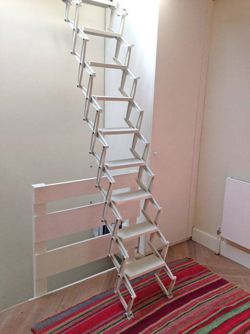 Elite concertina loft ladder for access to skylight over staircase.