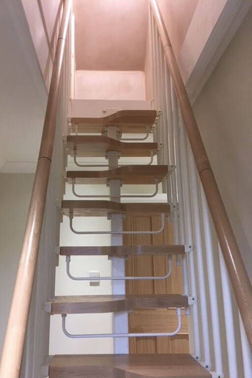 Compatta loft conversion stairs with two handrails and safety riser bars
