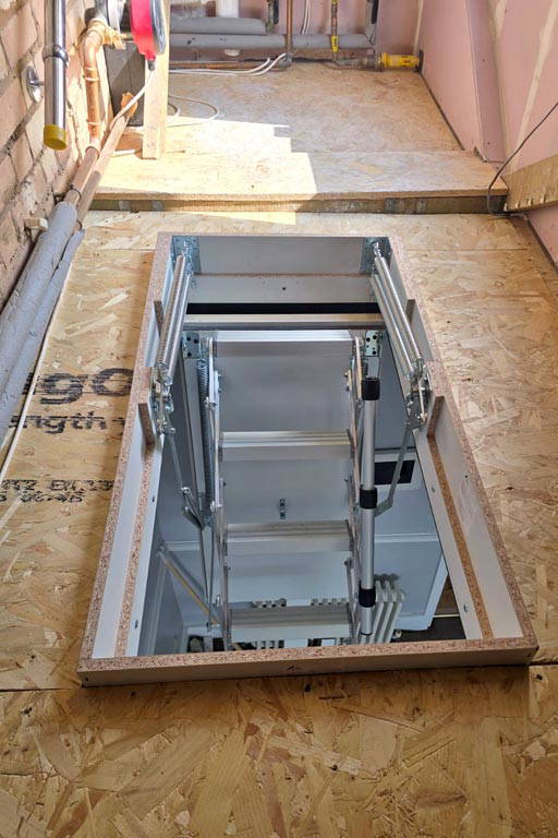 MiniLine fire-rated & space-saving concertina loft ladder. Installed into a grade II listed building.