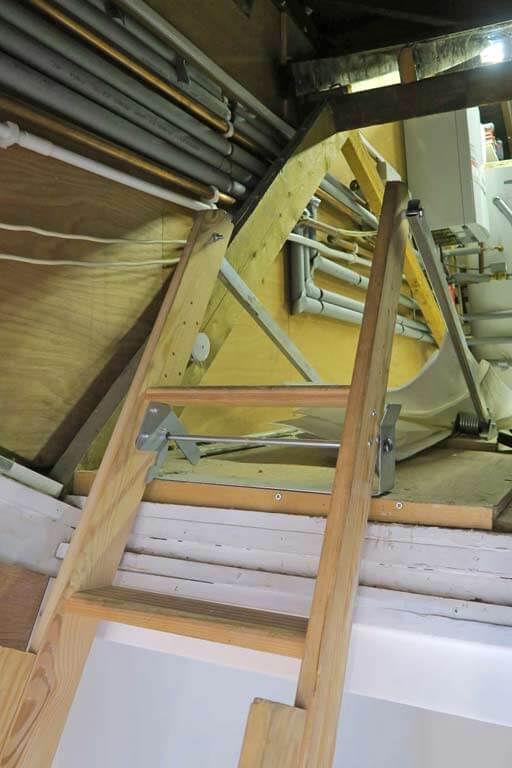 Sliding wooden loft ladder takes up lots of floor space and hard to use