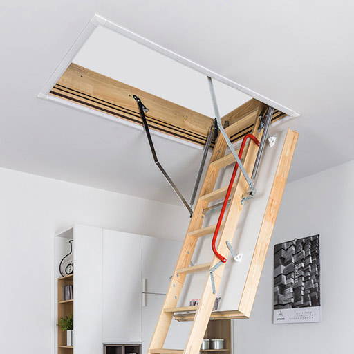 LWT wooden loft ladder installed in bedroom. Insulated hatch with airtight seal.